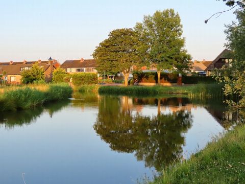 Mooie weerspiegeling met ondergaande zon / Els Leijten Helmons